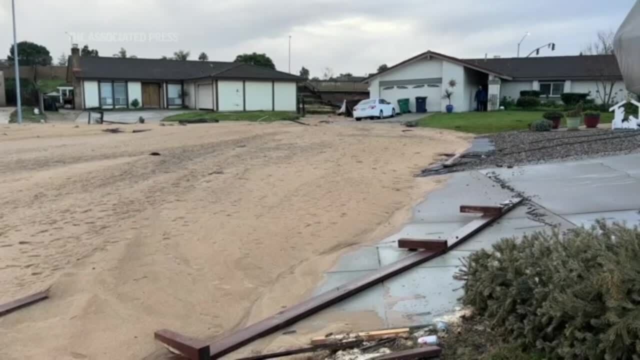 Floodwaters from latest California storm inundate neighborhoods and leave behind muddy mess